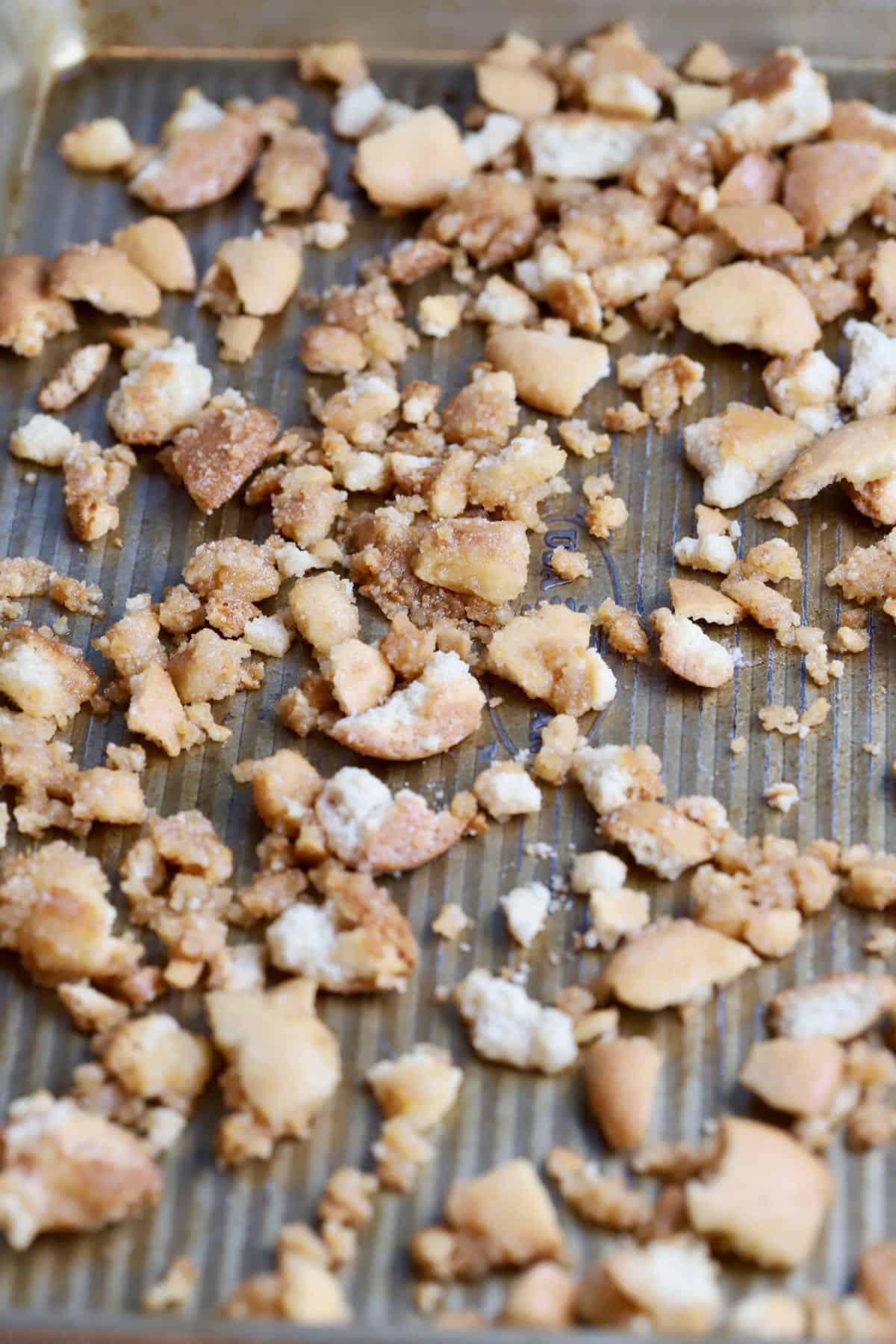 Toasting vanilla wafer crumbs on a baking sheet. 