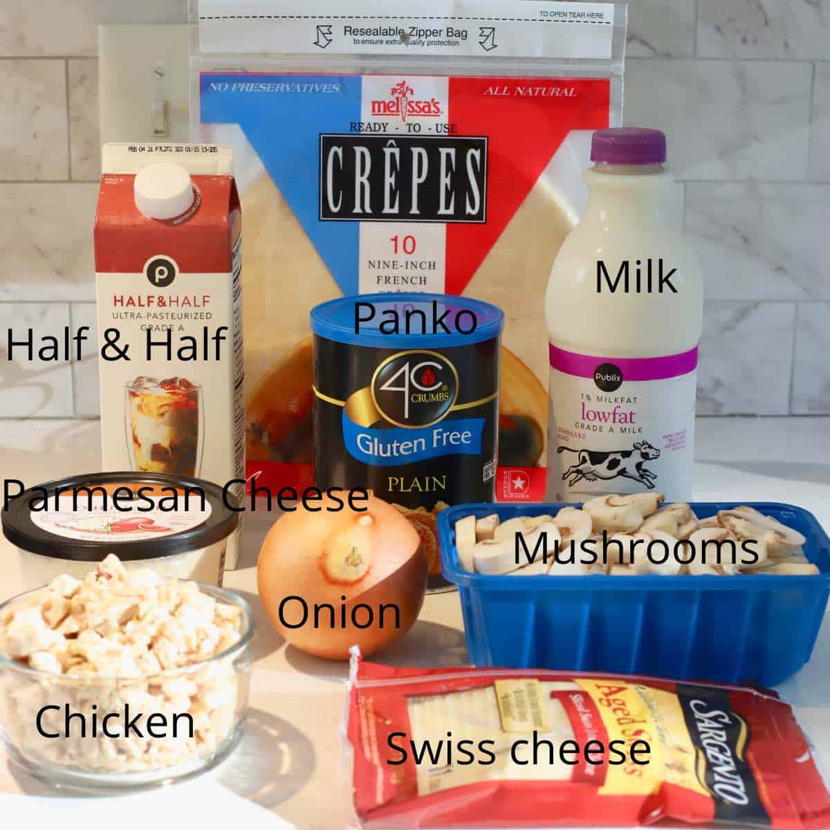 Ingredients for chicken crepes including mushrooms, chicken and half and half. 