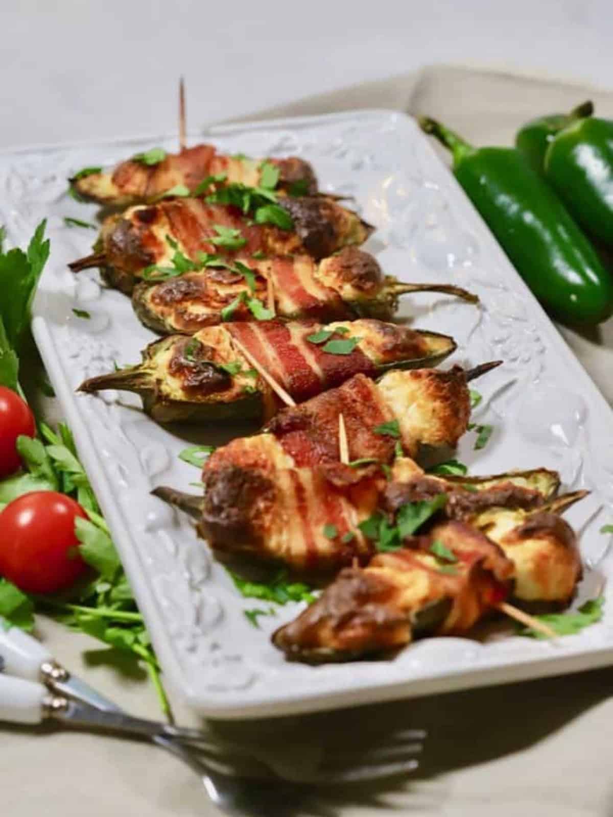 Jalapeno Poppers on a white serving didsh.