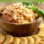 Pinterest pin showing pimento cheese in a wooden bowl with crackers.