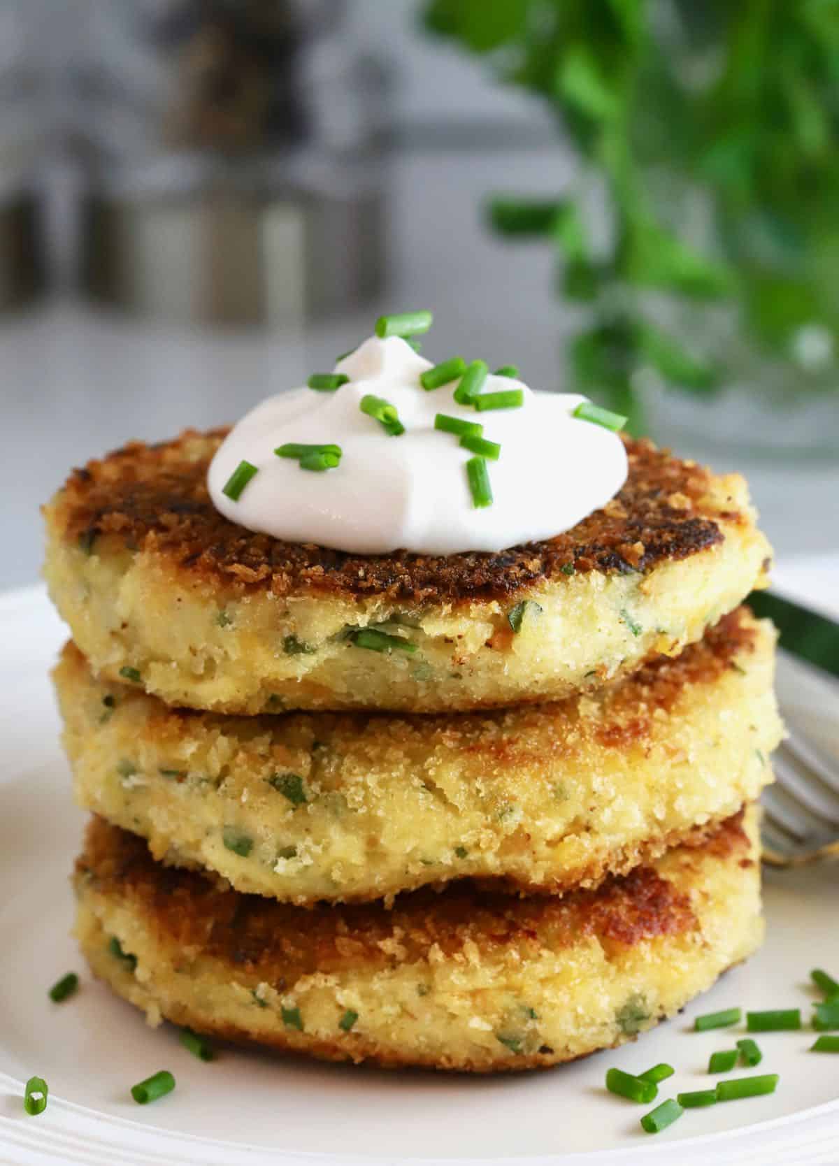 Potato fritters topped with sour cream and chives. 