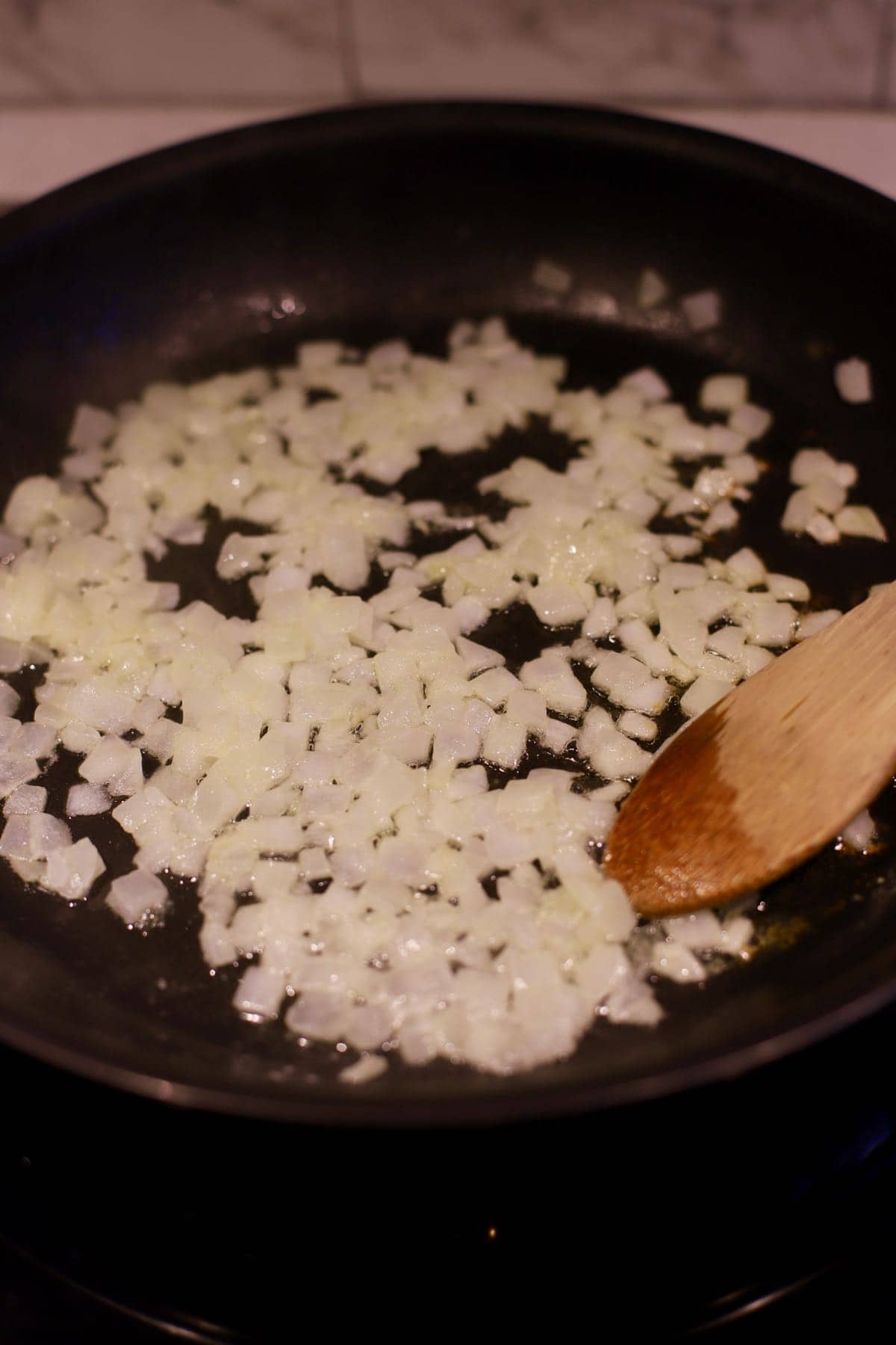 Cooking onions in a skillet.