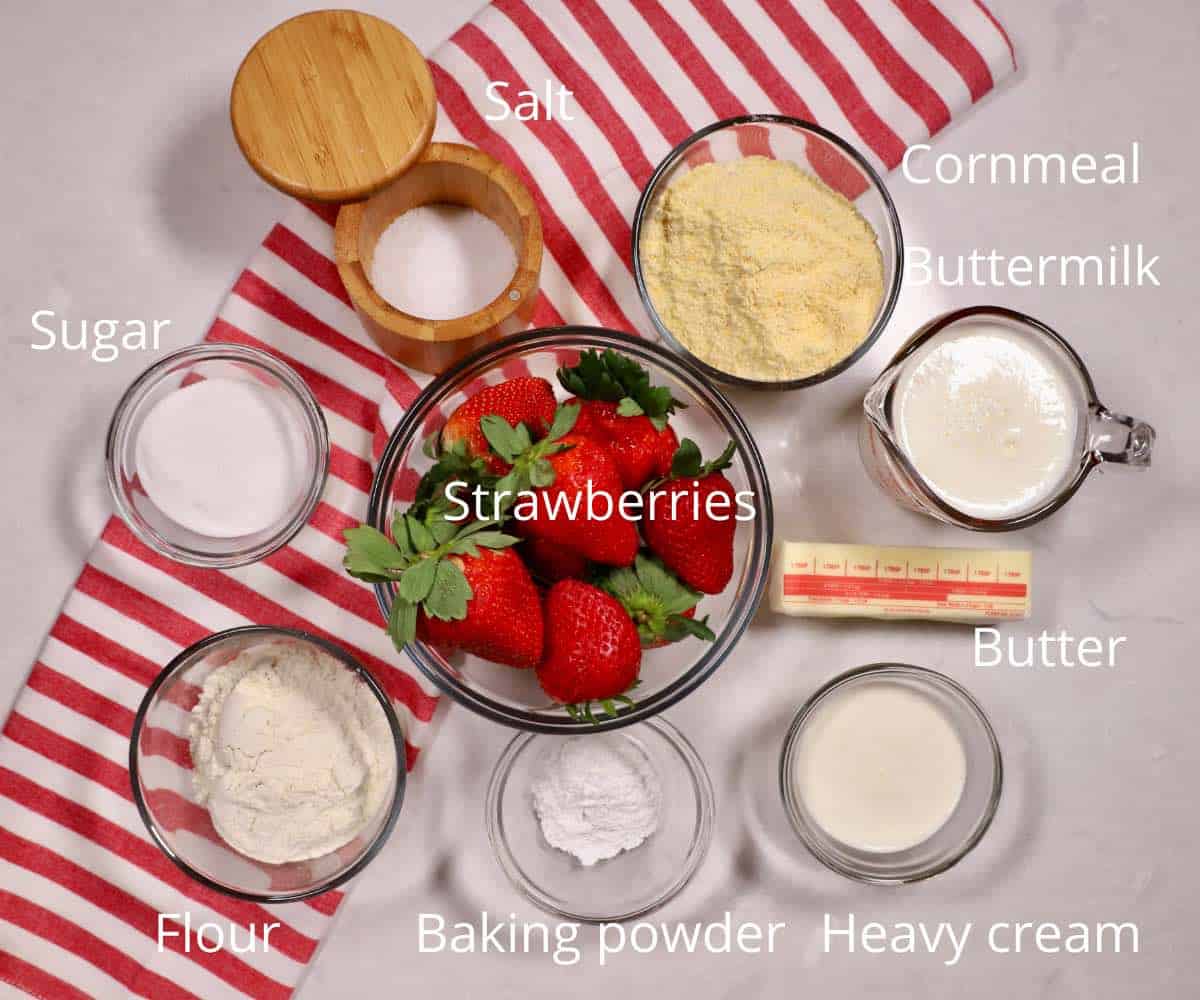 Ingredients for strawberry shortcake including strawberries and buttermilk. 