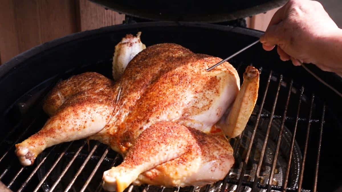 Smoking a chicken on a green egg.