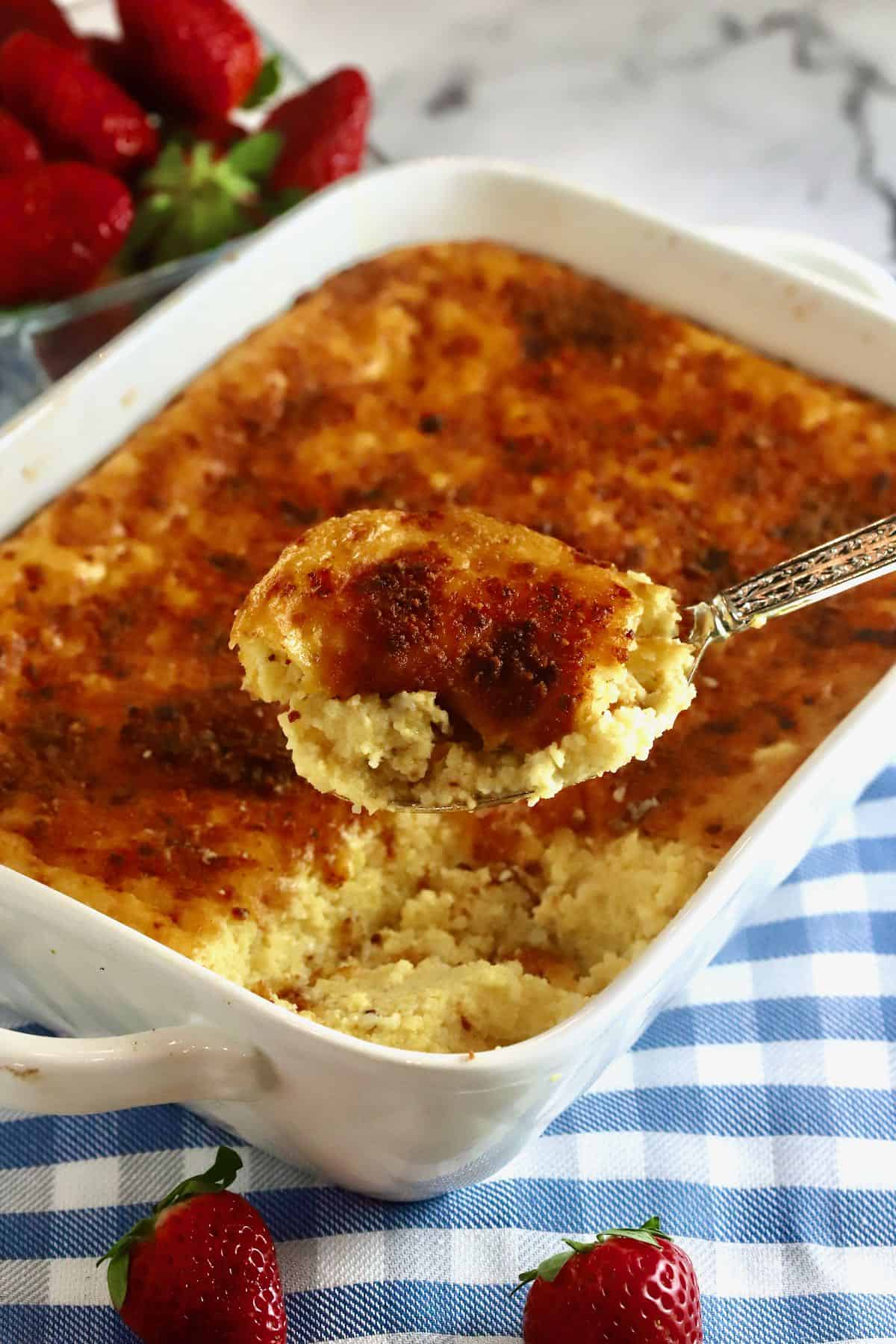 A spoonful of cheese grits casserole.