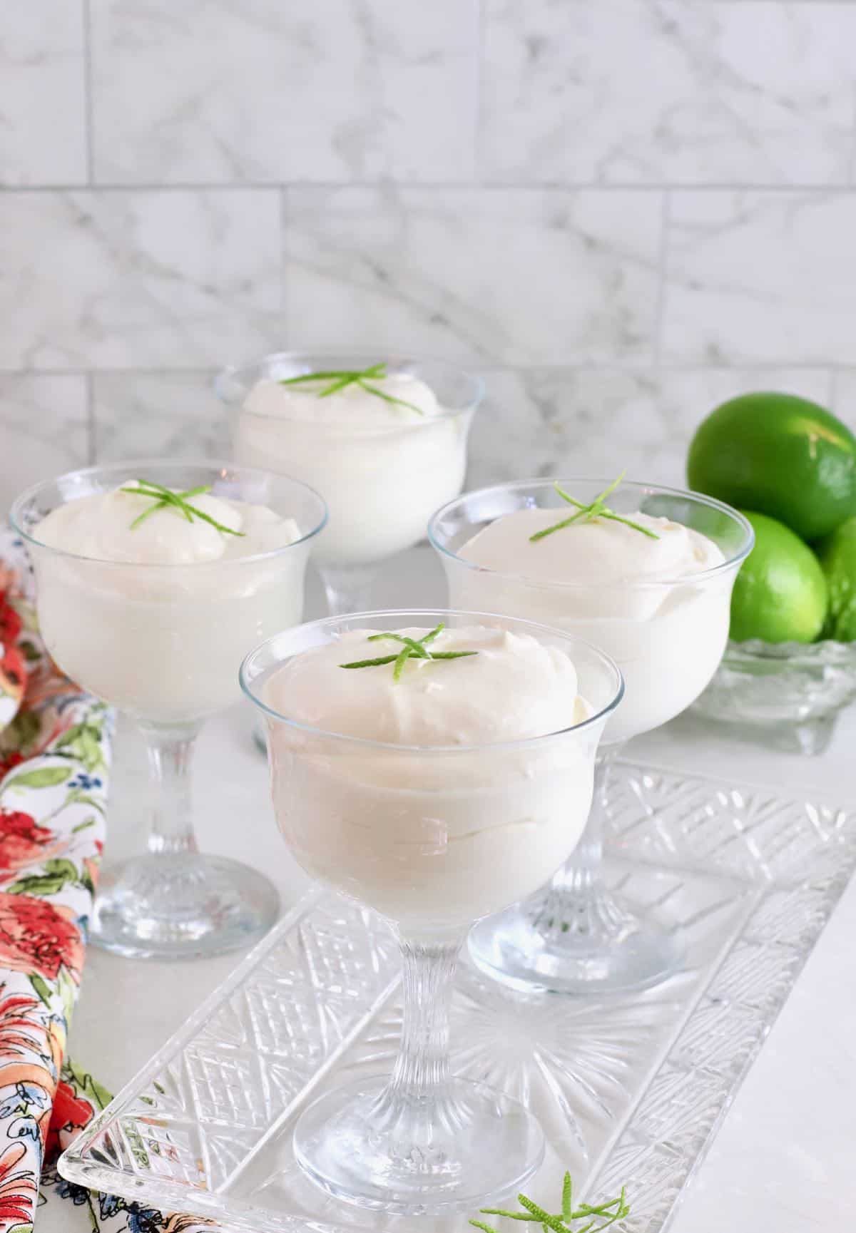 Four glass dessert cups with Key Lime Mousse.