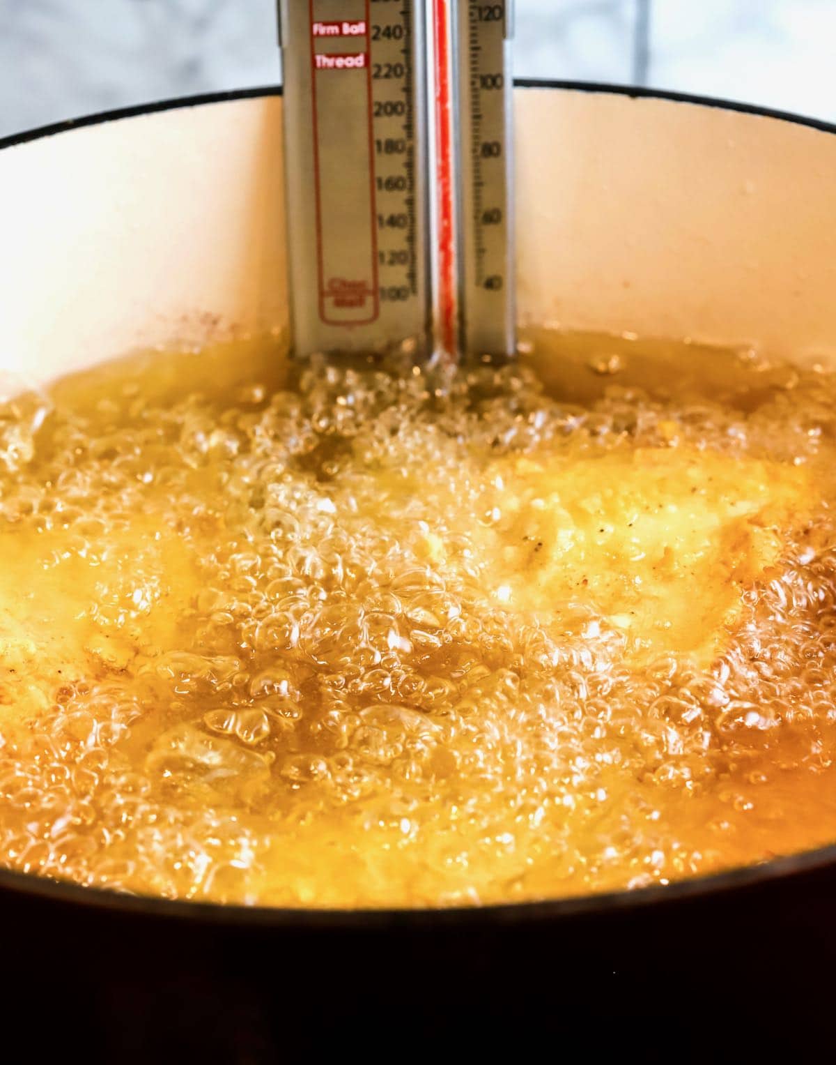 Frying chicken in a dutch oven. 