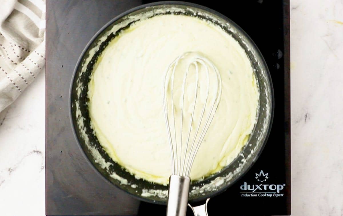 Melted butter, cream cheese and blue cheese with a whisk.