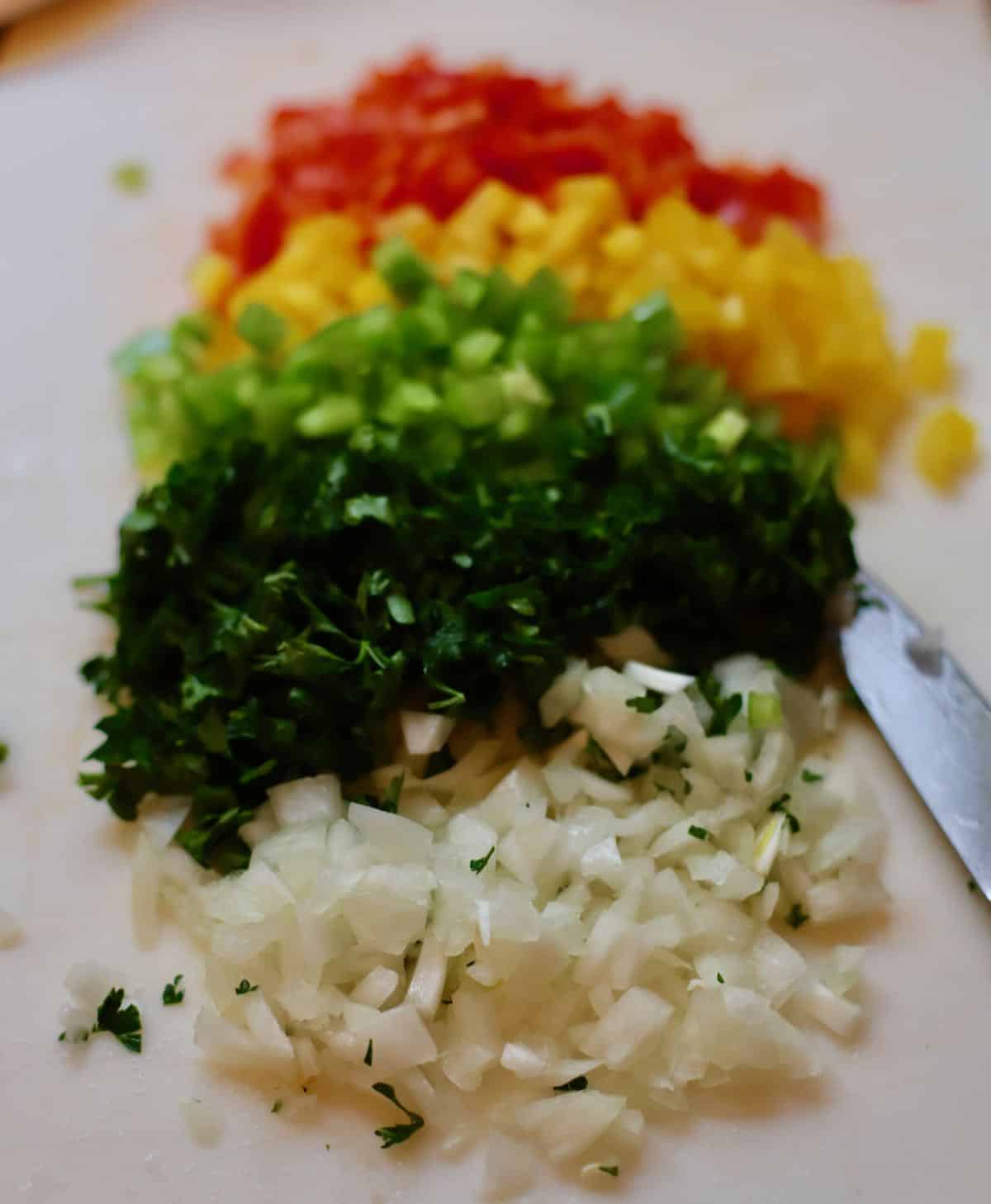 Chopped veggies including onion and bell peppers.