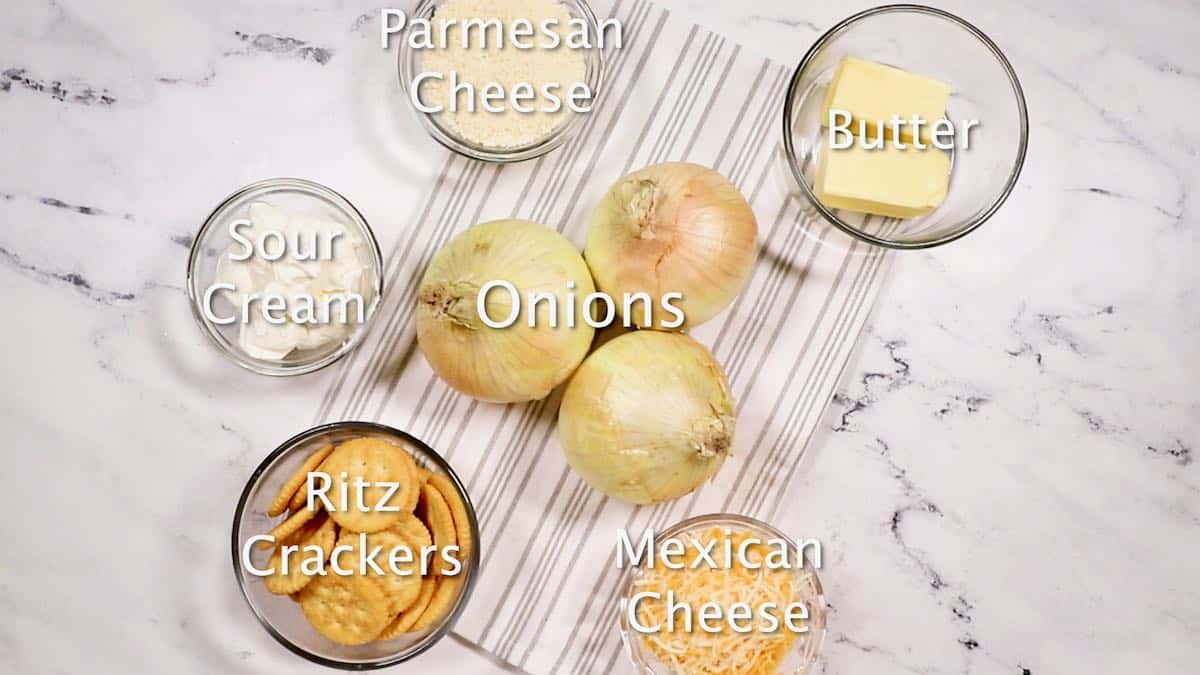 Ingredients for onion casserole including cheese and Ritz crackers.