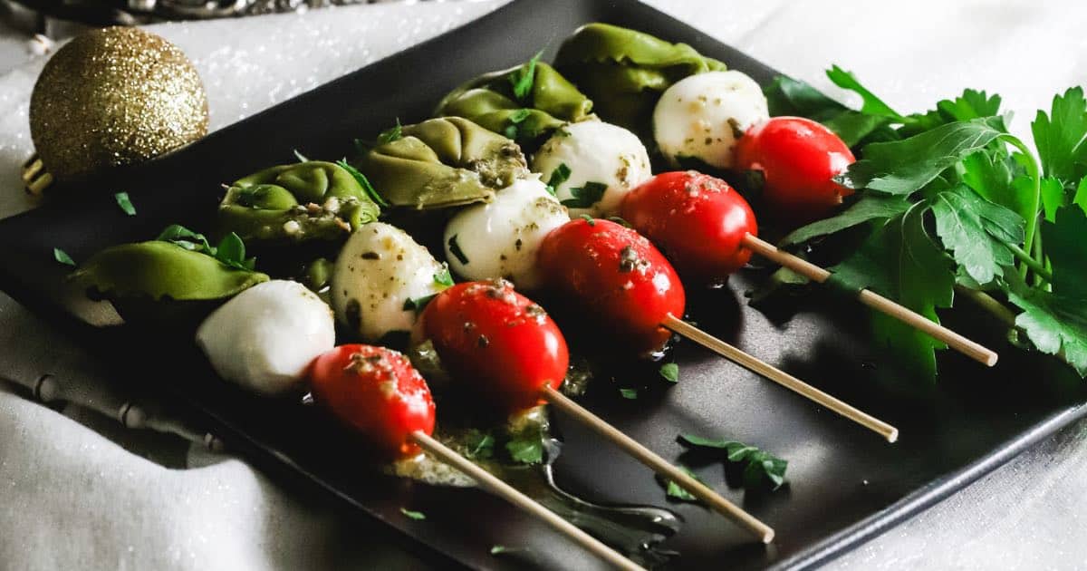 Easy Caprese Skewers with Pesto Dressing | gritsandpinecones.com