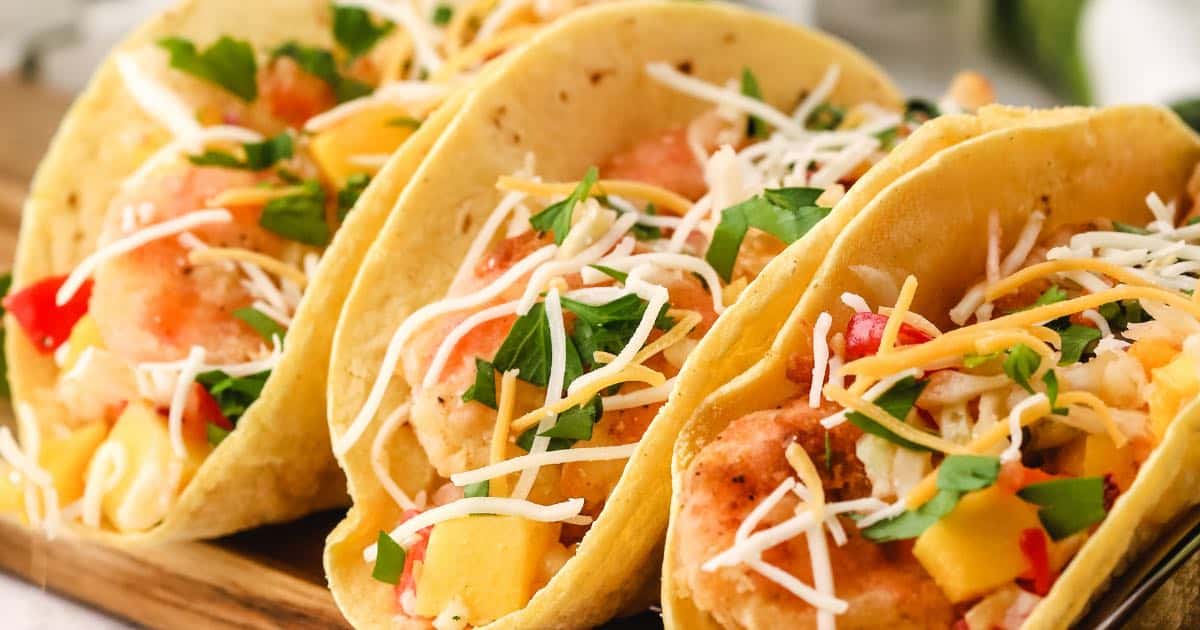 Fried Shrimp Tacos with Mango Slaw | gritsandpinecones.com