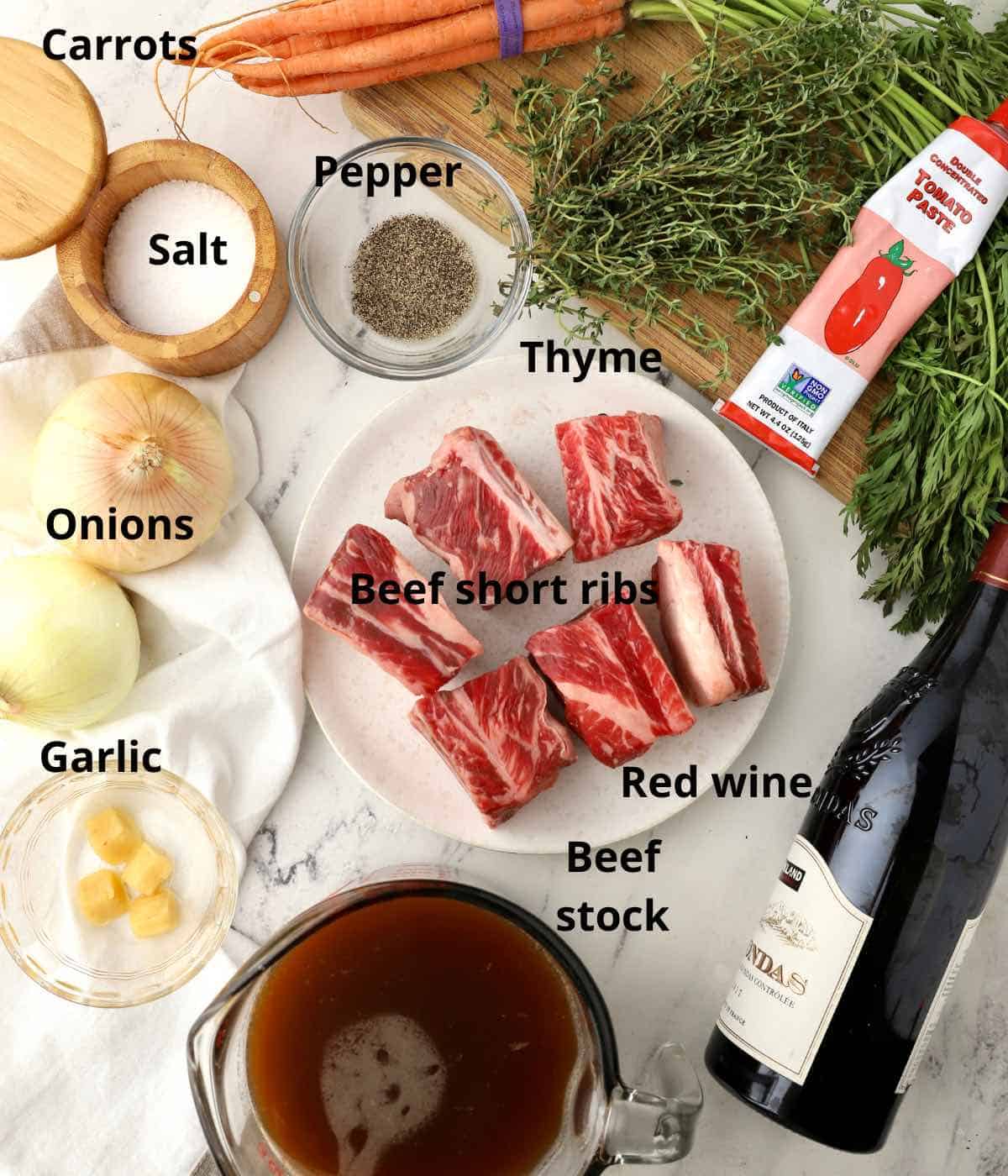 Ingredients for Braised Beef Short Ribs including a bunch of thyme. 