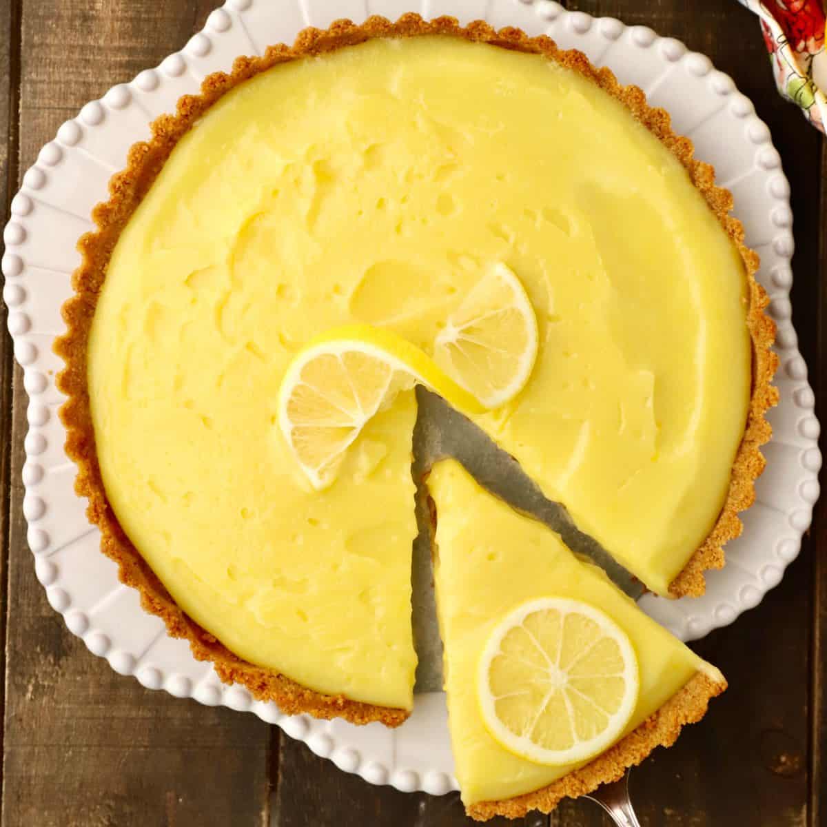 A Meyer Lemon Tart on a white serving dish.