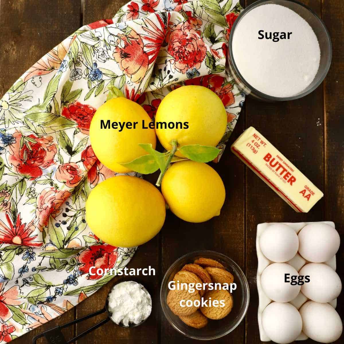 Four Meyer lemons and  other ingredients for a lemon tart. 
