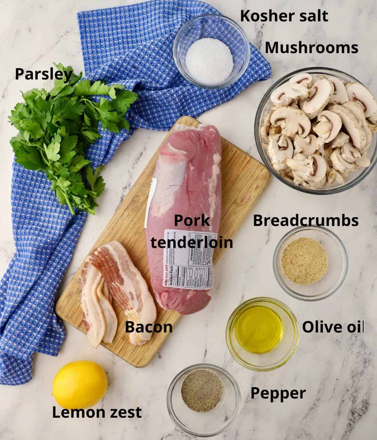 Ingredients for stuffed pork tenderloin including sliced mushrooms. 