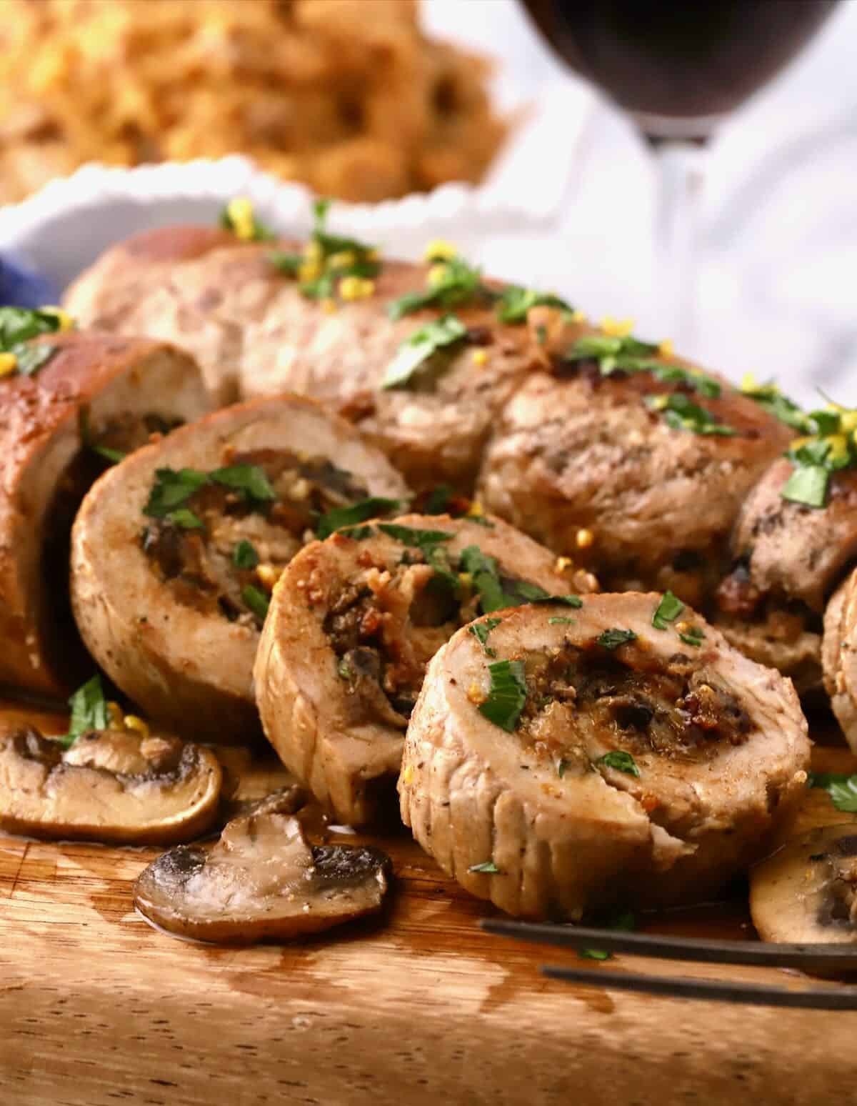 Slices of mushroom stuffed pork tenderloin. 