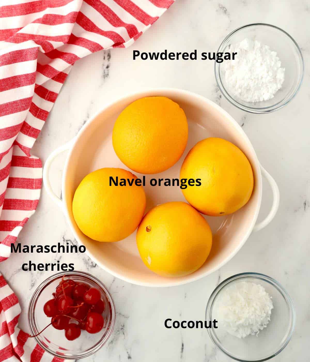 Navel oranges, powdered sugar, cherries and coconut . 