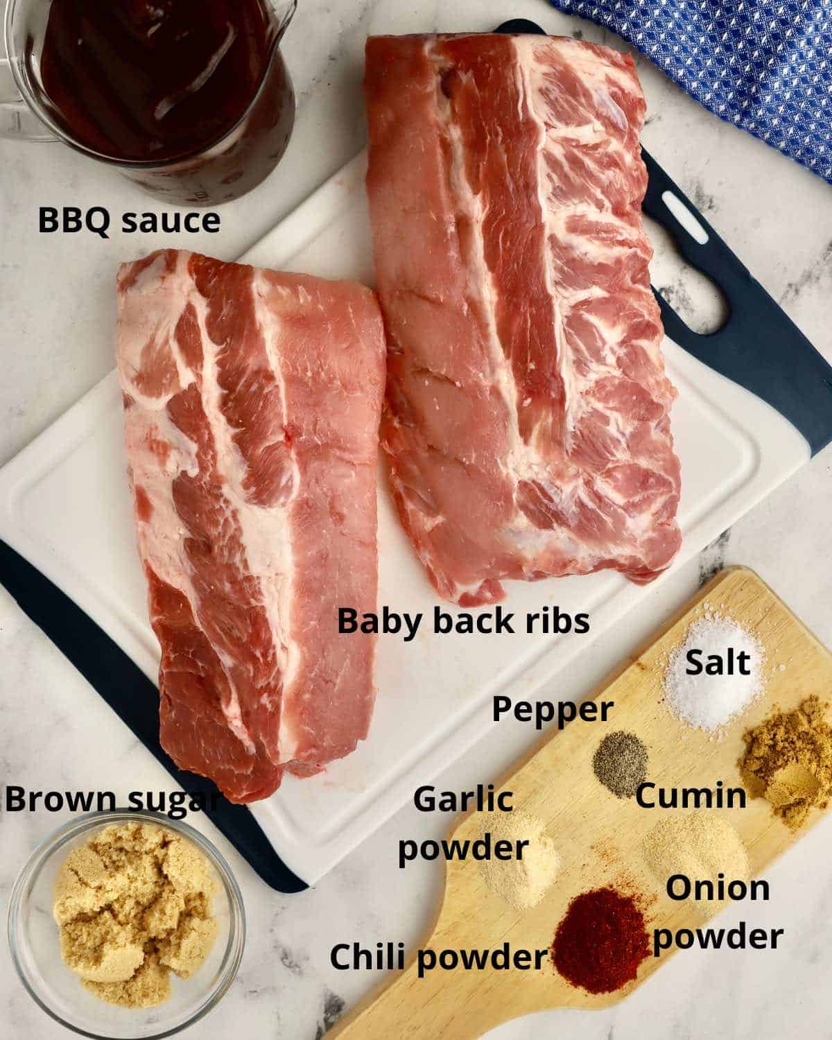 Two racks of ribs along with spices to make a dry rub.