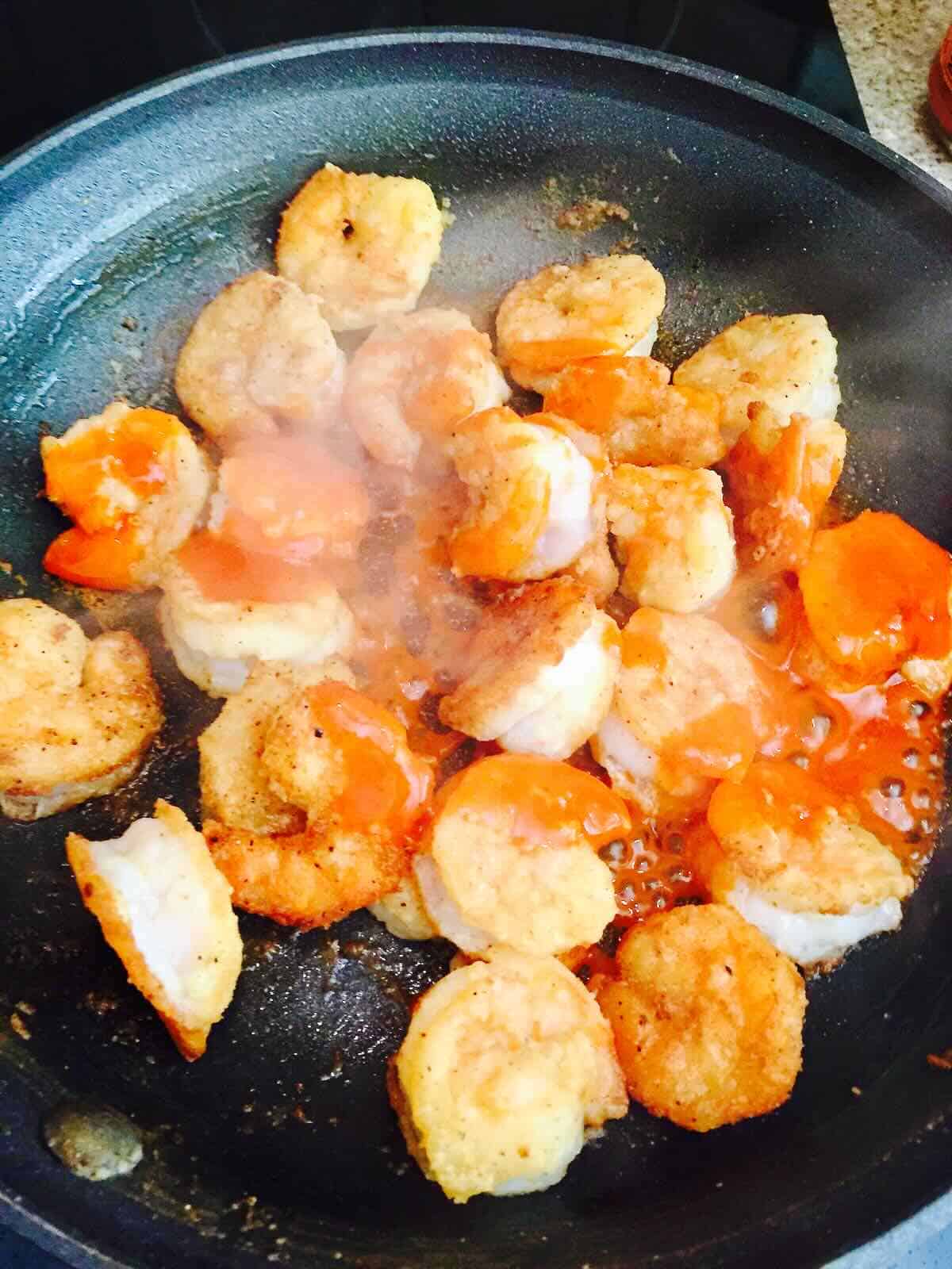 Breaded pan-fried shrimp topped with buffalo sauce. 