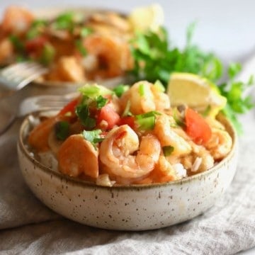 A bowl of shrimp creole served over rice.