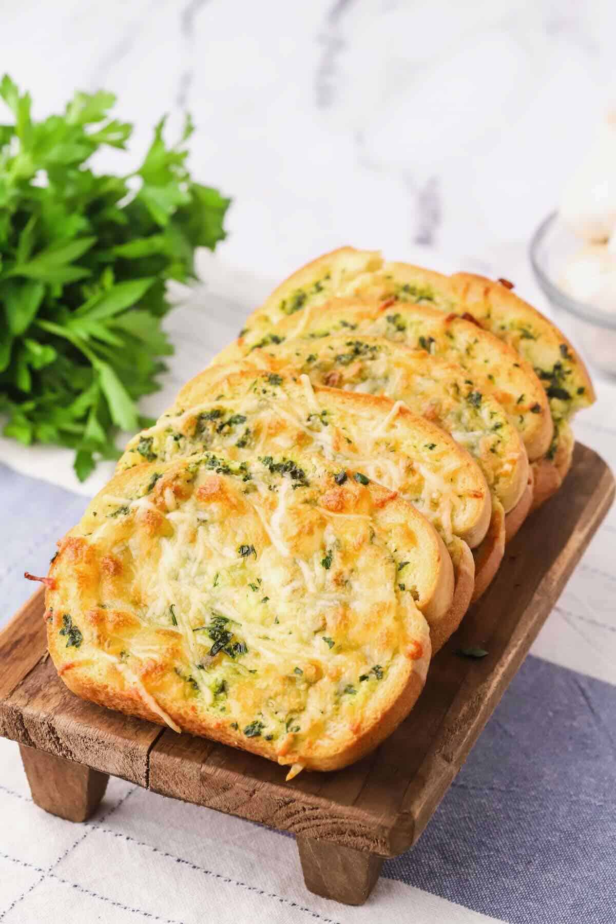 Texas toast garlic bread topped with melted cheese ready to serve. 