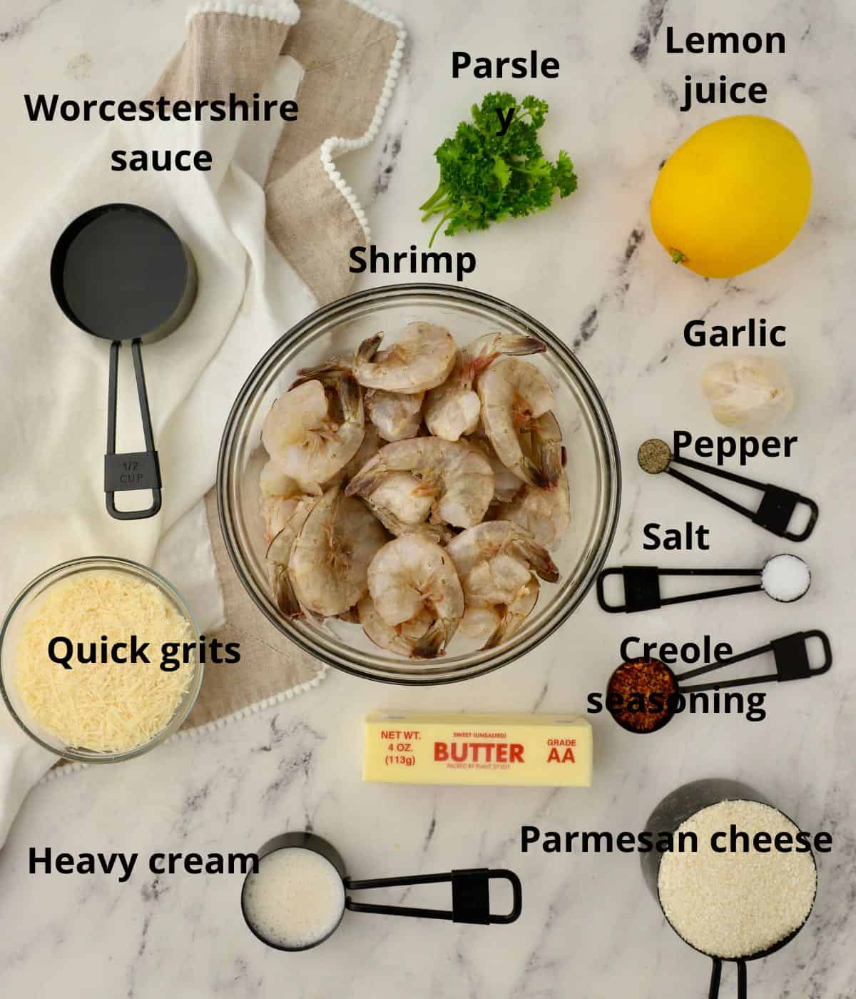A bowl of fresh shrimp and other ingredients to make shrimp and grits. 