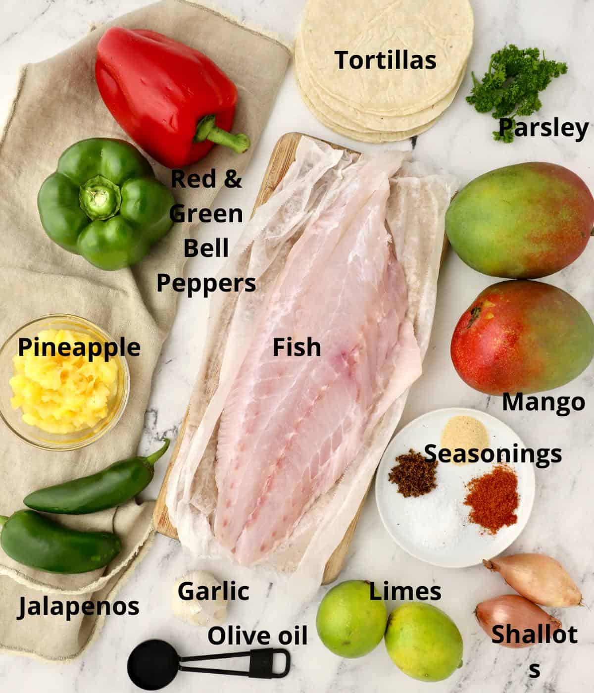 Fish fillets plus ingredients for mango salsa. 