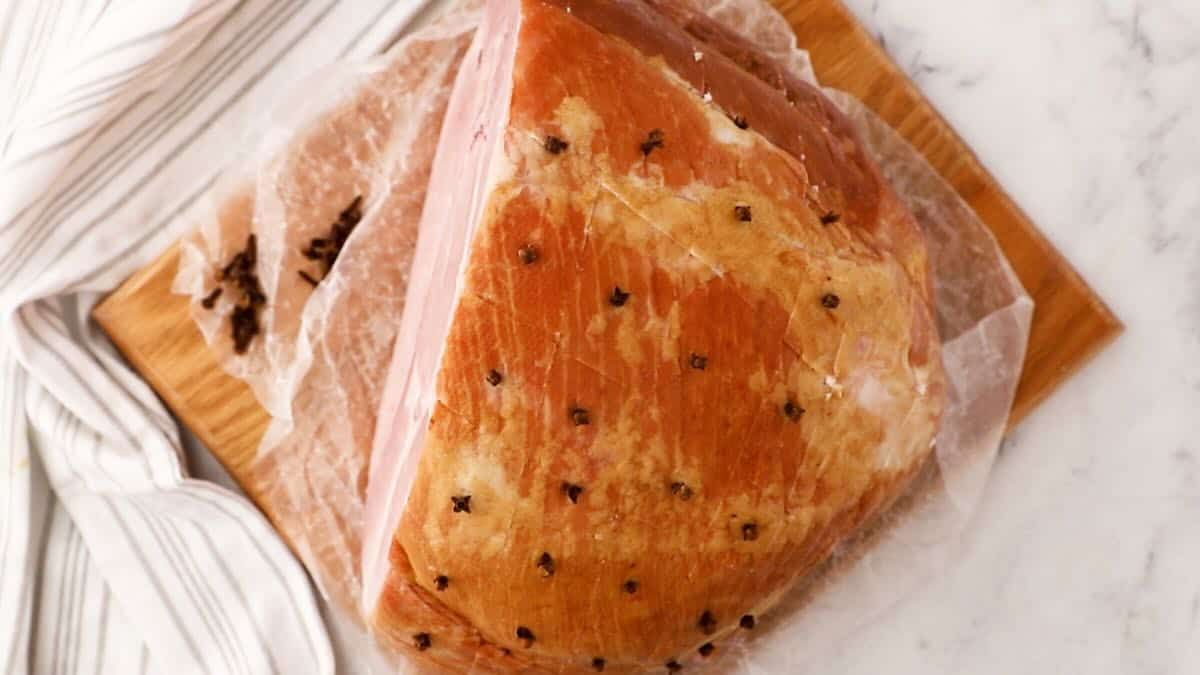 Cloves inserted into a whole ham. 