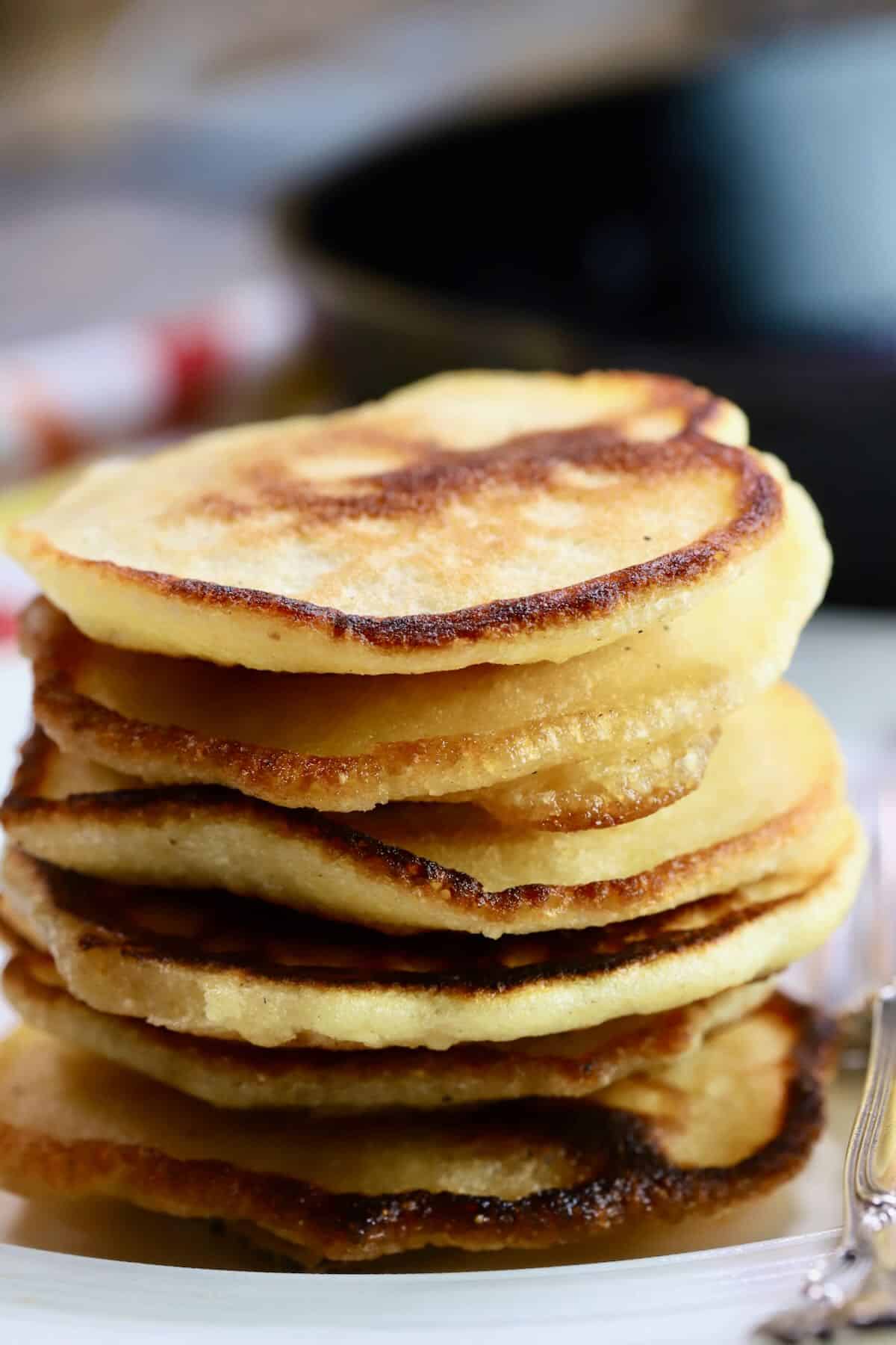 A stack of southern hoe cakes on a white plate. 