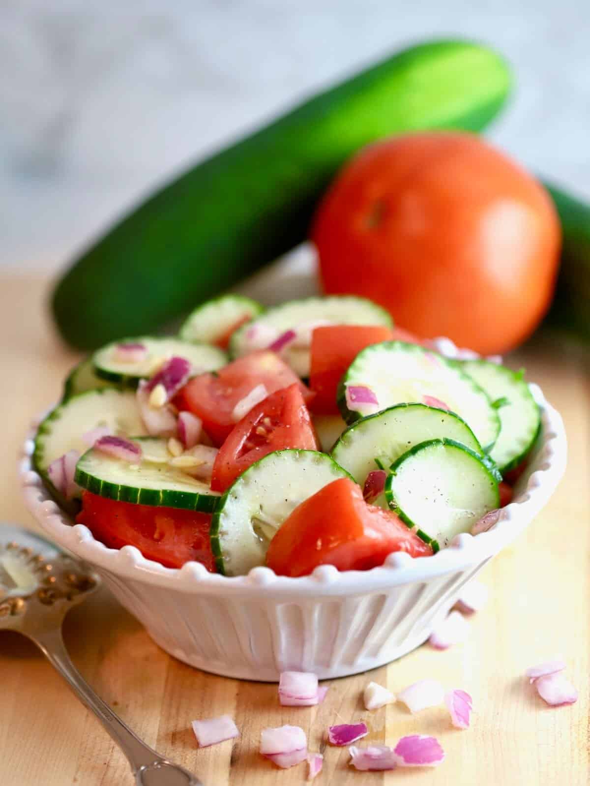 Cucumber and Tomato Salad in w white serving bowl. 