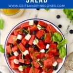 Pinterest pin showing a bowl of watermelon salad with feta, and blueberries.