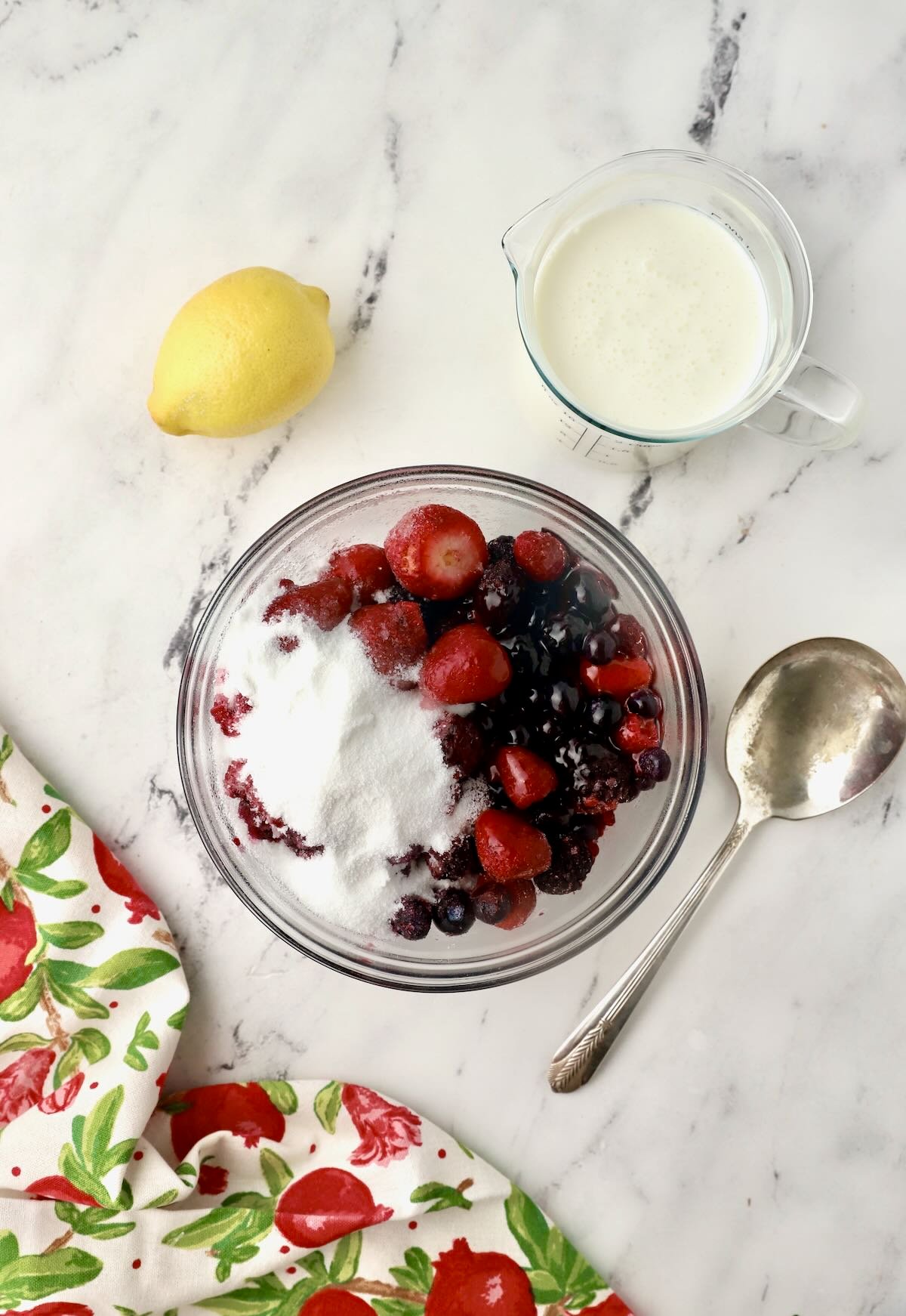 Mixed berries topped with sugar and kara syrup.