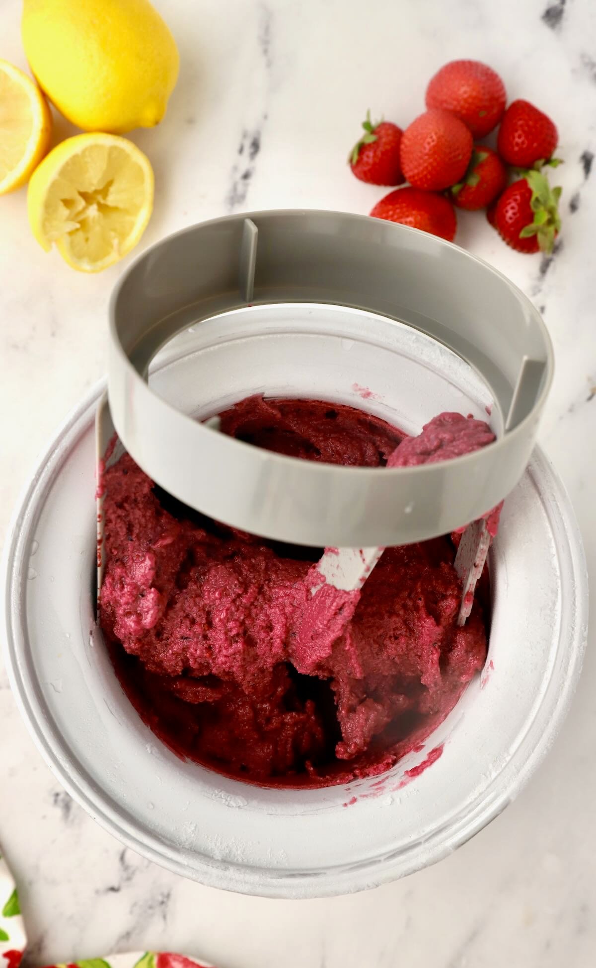 Mixed berry sherbet in an electric ice cream maker. 