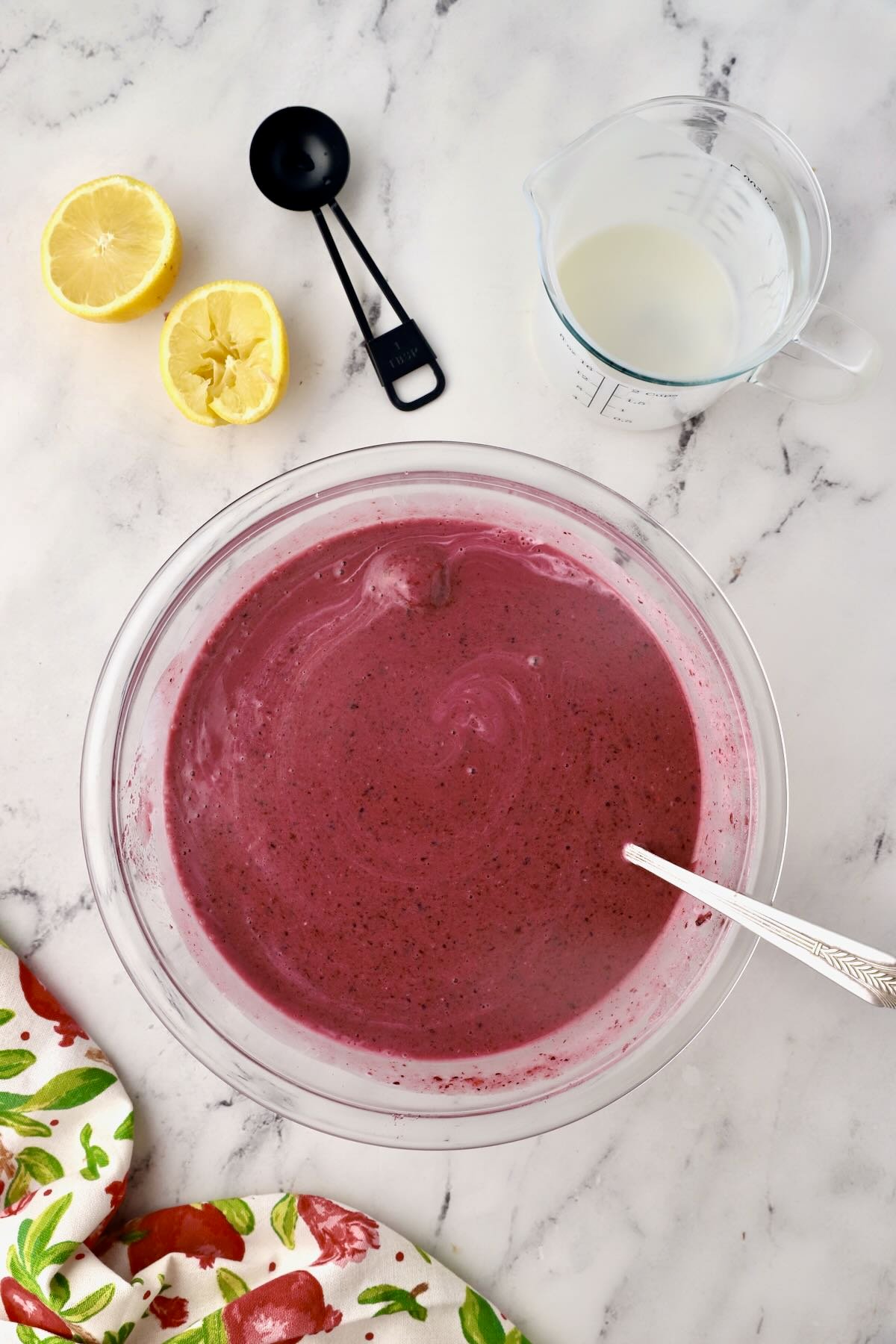 A bowl of pureed mixed berries and other ingredients to make sherbet.