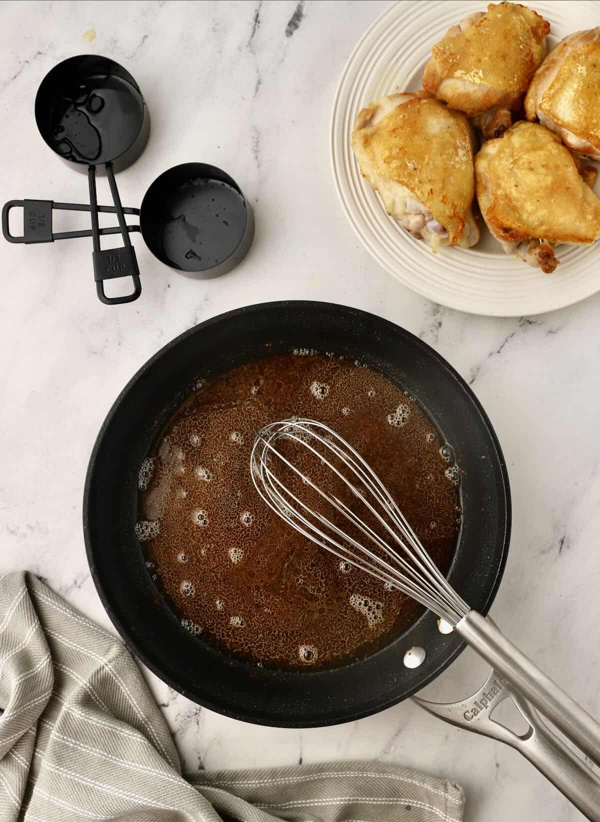 Honey glaze simmering in a skillet. 