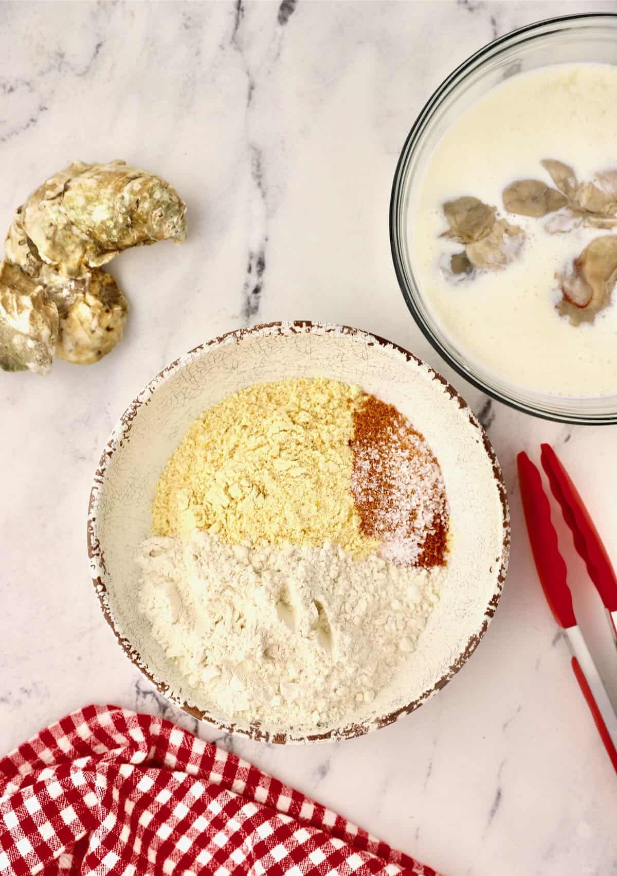 Cornmeal, flour and seasonings in a bowl. 