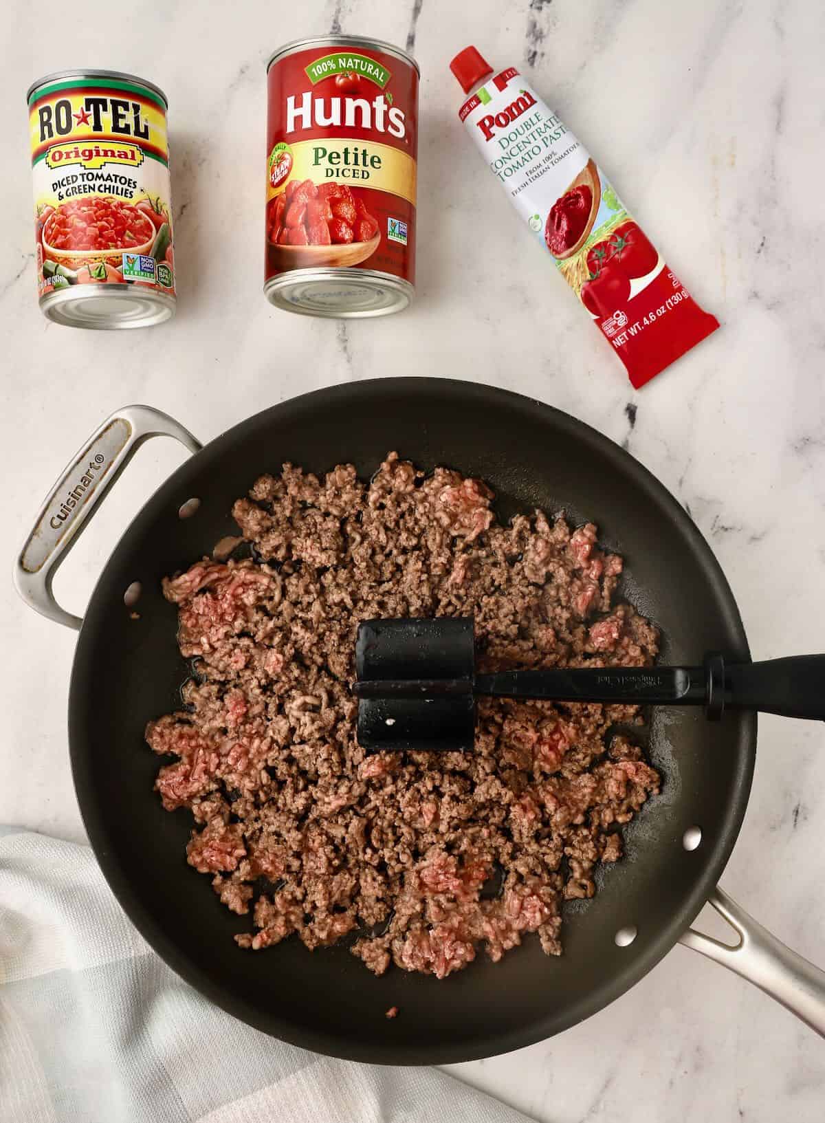 Browning hamburger meat in a skillet. 