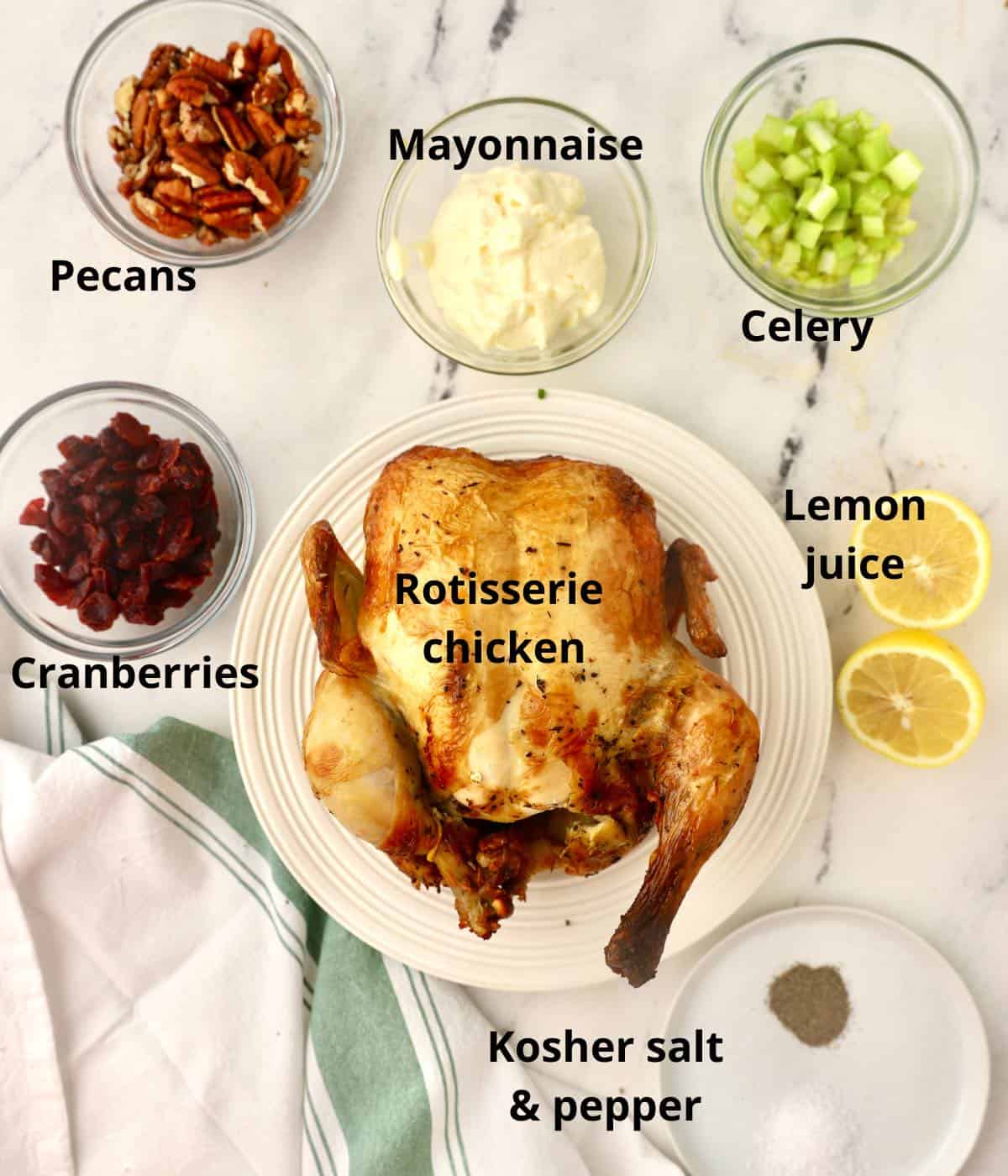 A rotisserie chicken, cranberries, pecans, celery and mayonnaise. 