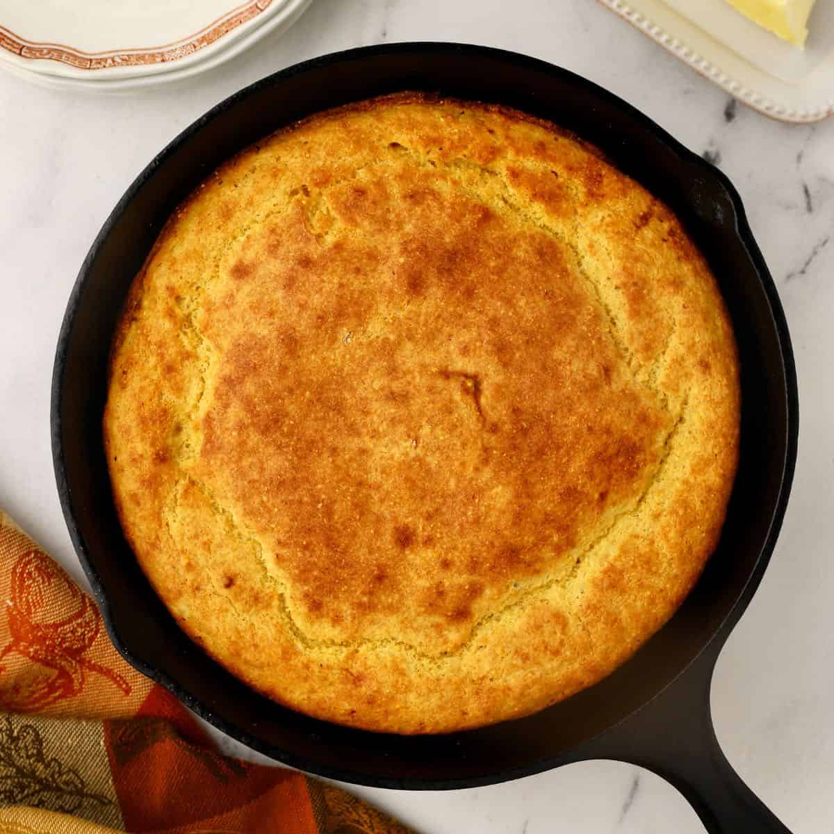 https://www.gritsandpinecones.com/wp-content/uploads/2022/09/southern-cornbread-featured-1200x1200-copy.jpg