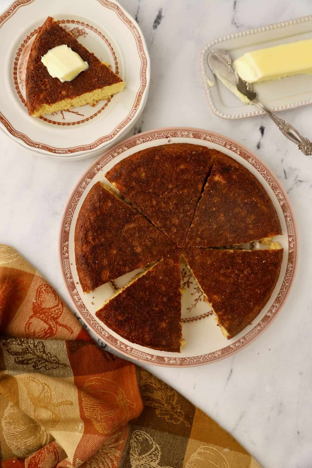 A cornbread round cut into wedges.