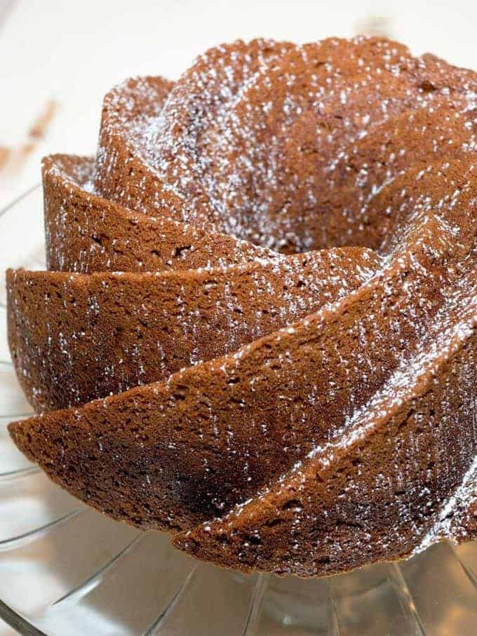 Pumpkin bundt cake topped with confectioners sugar. 