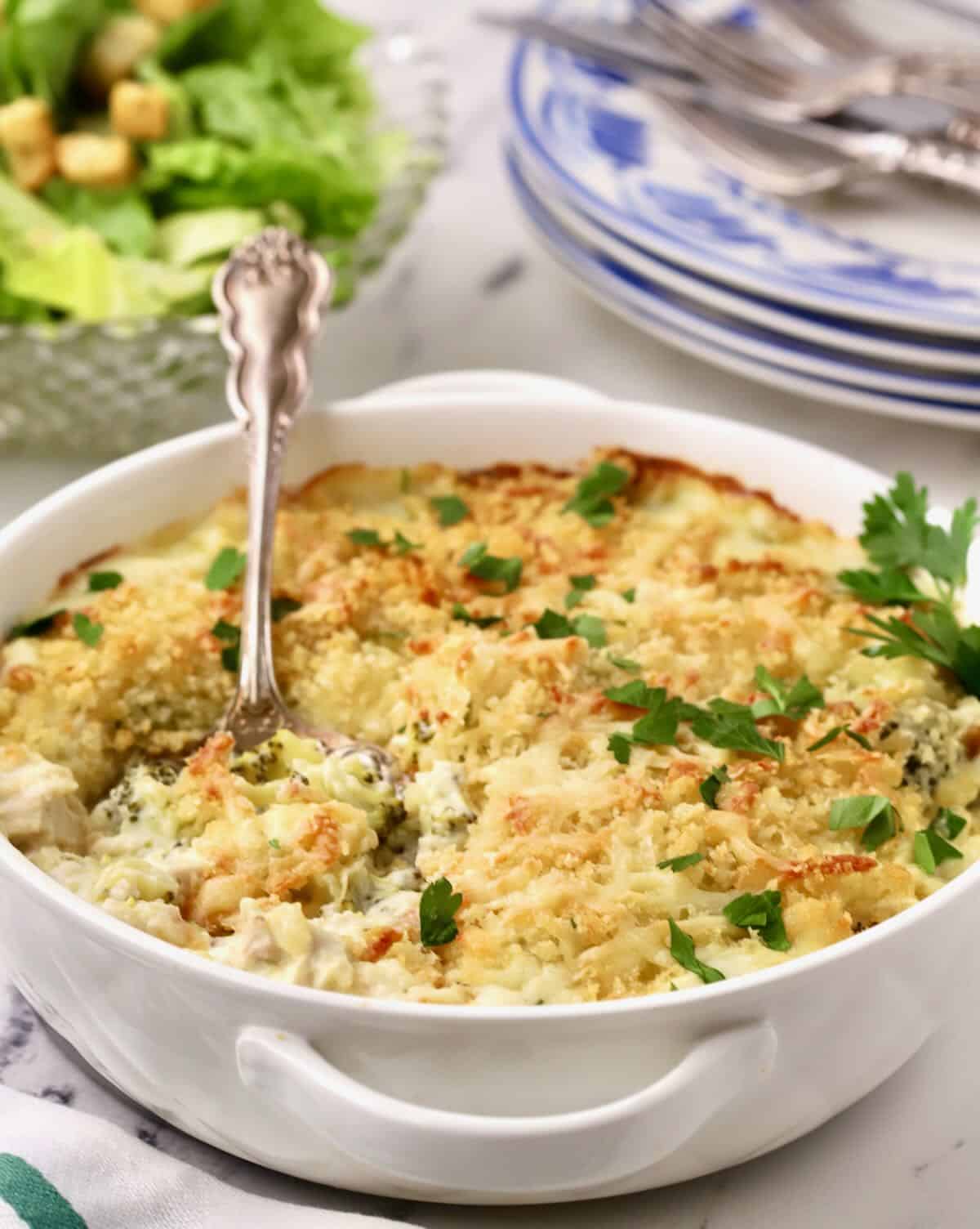 A chicken casserole in a white baking dish. 