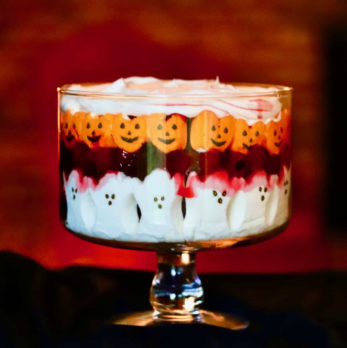 Halloween dessert trifle with ghosts and pumpkin peeps. 