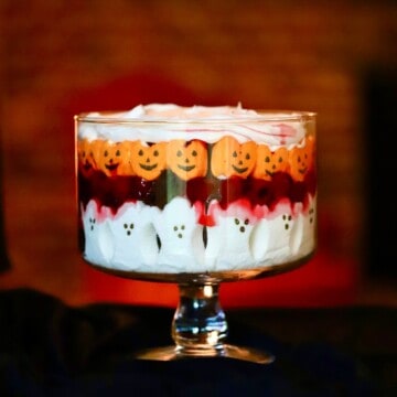 A trifle bowl with a black forest Halloween trifle.