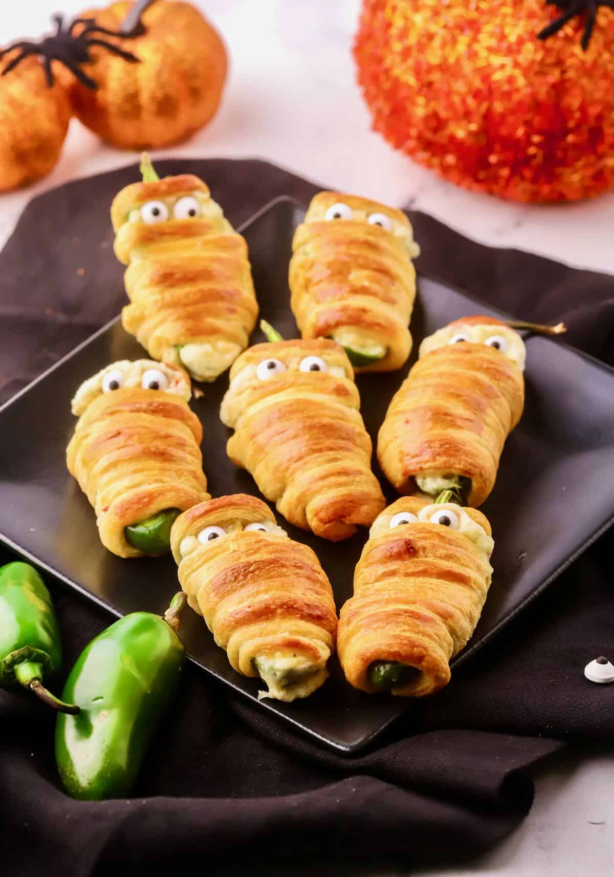 Jalapenos wrapped in crescent roll dough and baked. 