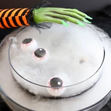 A punch bowl full of punch with smoke coming out of it.