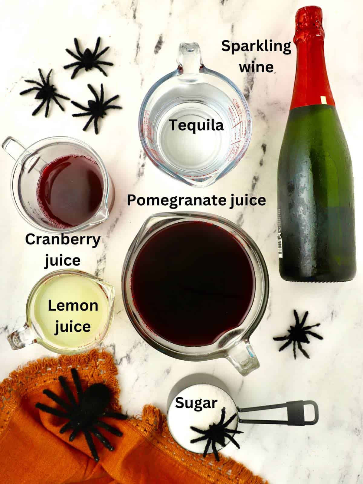 Ingredients for a Halloween punch including pomegranate and cranberry juice. 