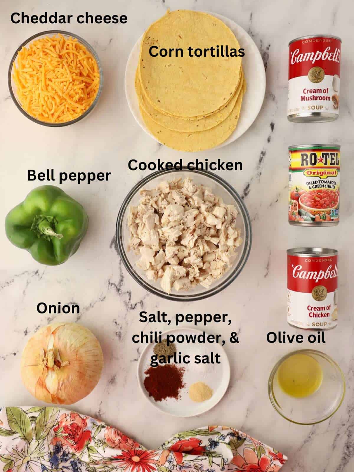 Ingredients for a chicken casserole including condensed soup, cheese, bell pepper and an onion. 