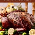 Pinterest pin showing a whole smoked turkey with lemon and other garnishes.